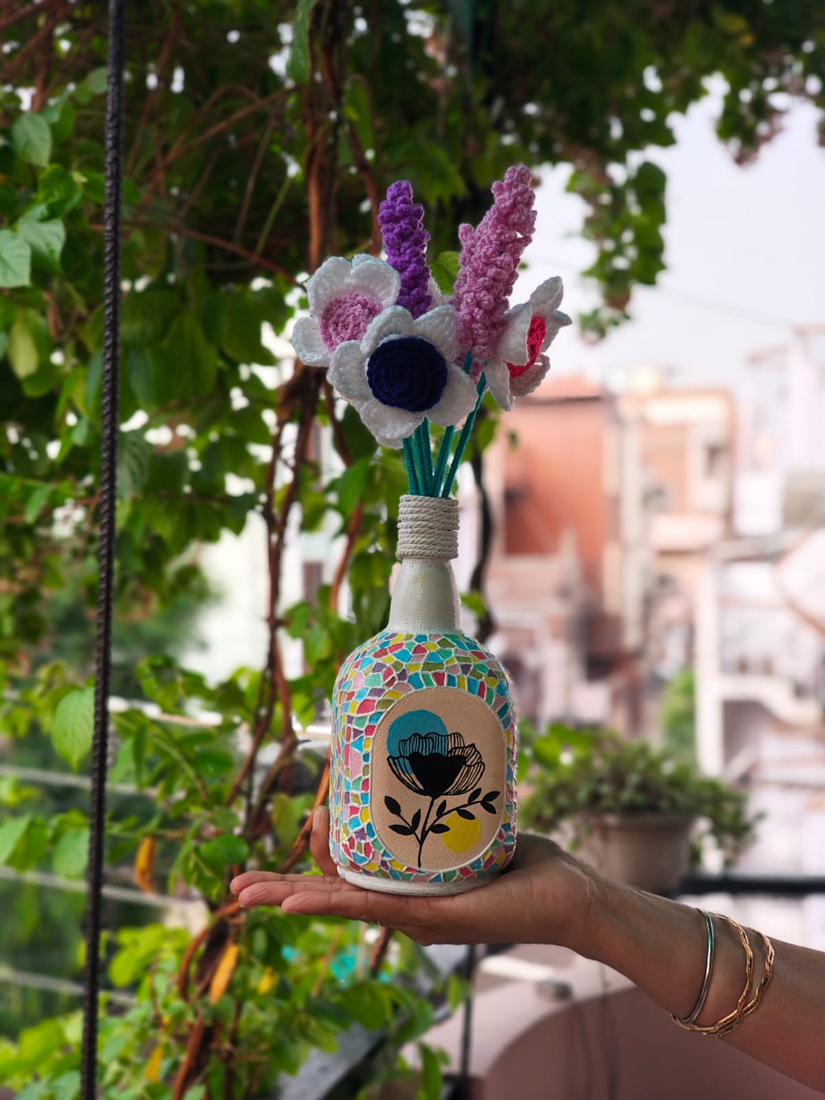 Handmade painted decorative bottle for living room, shelf, and table decoration.