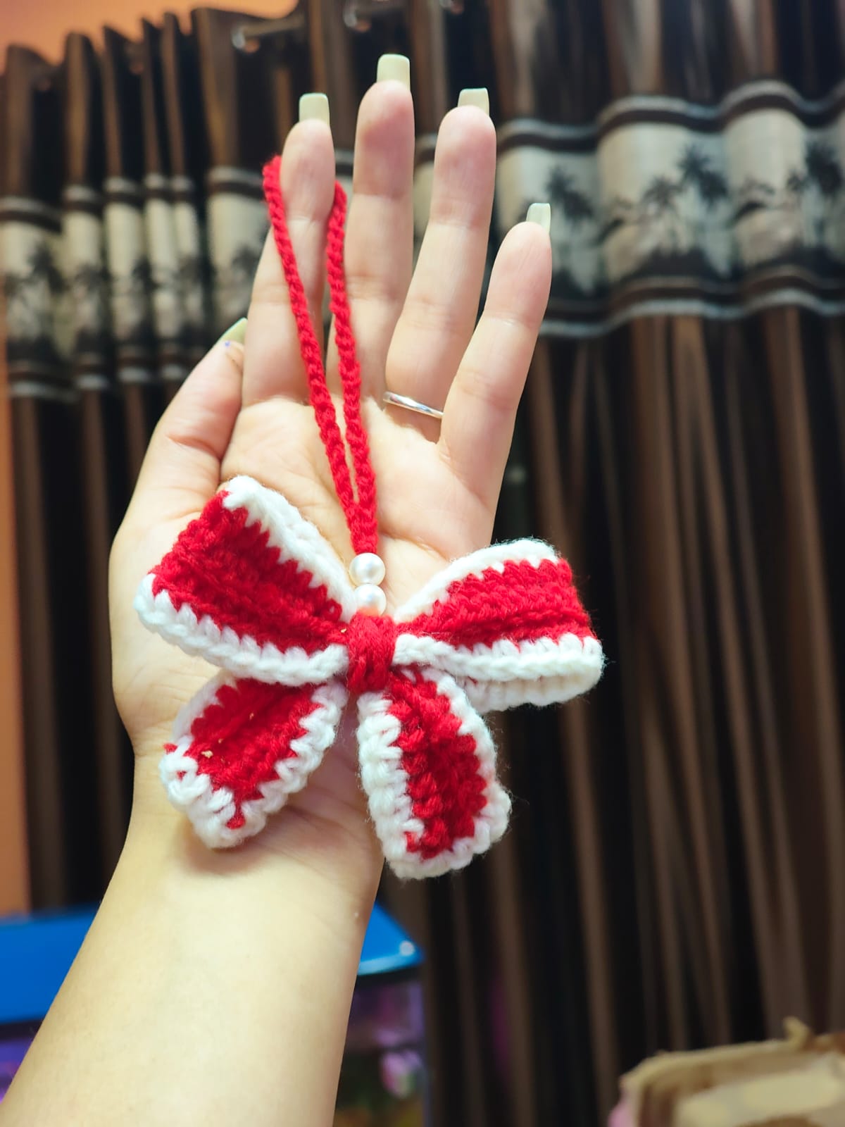 Handmade crochet pearl bow keychain, elegant white yarn bag charm India