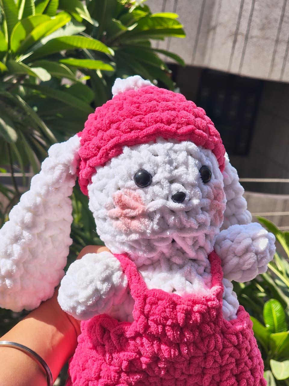 Blushie Bunny handmade crochet plush featuring white chenille yarn, pink overalls, and a cozy winter cap, perfect for nursery décor, gifting, and plush collections.