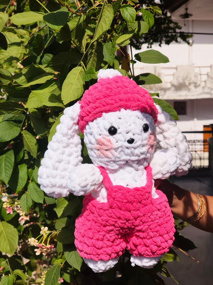 Crocheted toy with pink hat 