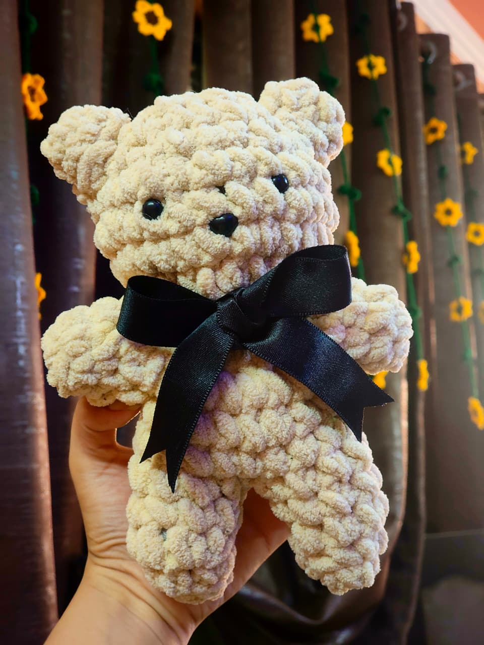 Brownie handmade crochet teddy bear plush with black satin bow crafted from ultra-soft chenille yarn.