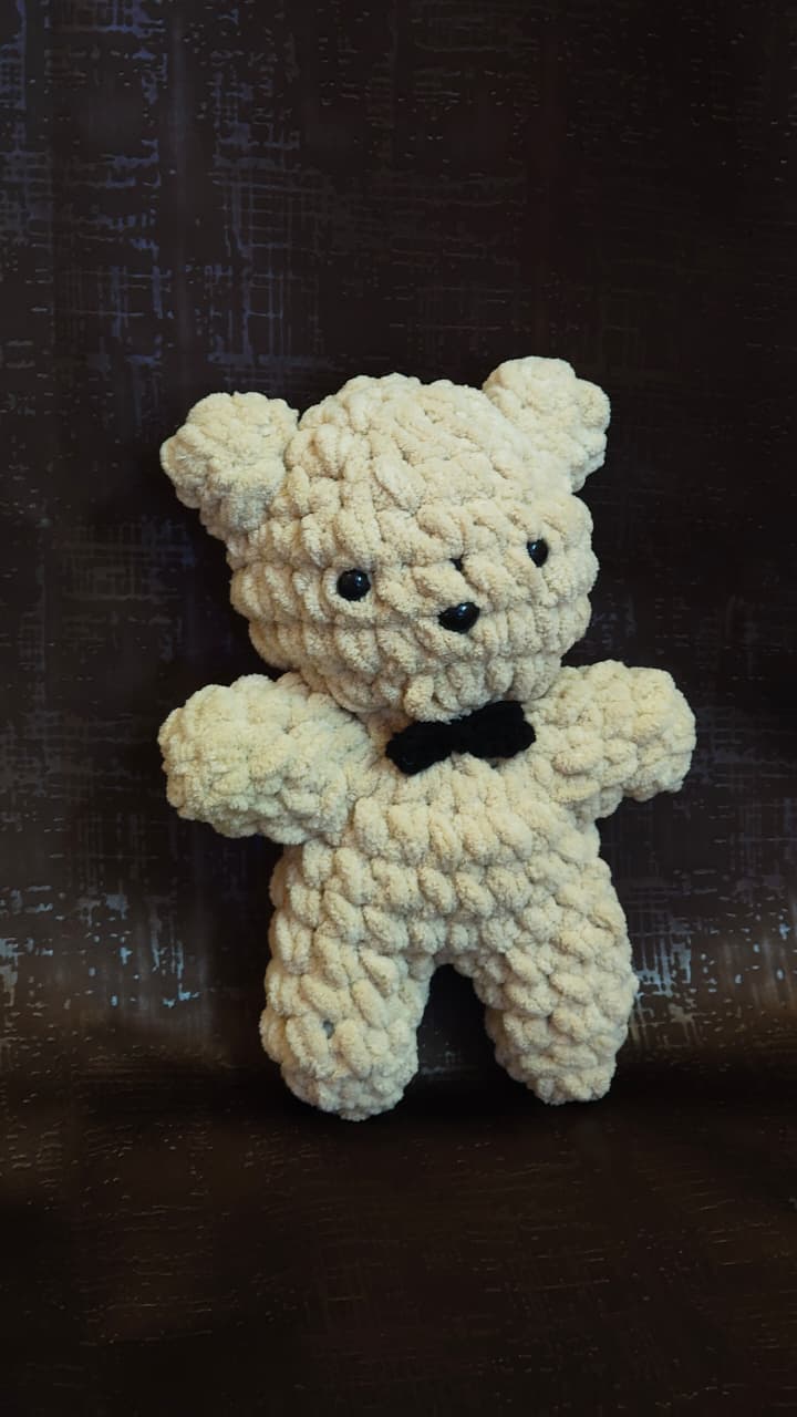 Muffin handmade crochet teddy bear plush made with ultra-soft premium blanket yarn and black bow tie.