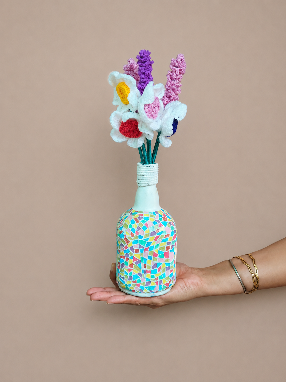Unique hand-painted home décor bottle featuring vibrant mosaic design by Cocostuff.in.