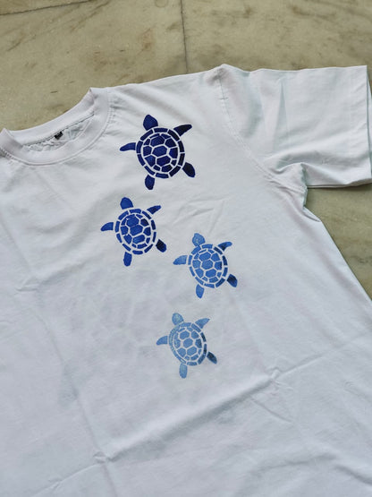 Premium cotton hand-painted turtle t-shirt featuring unique ocean-inspired artwork on both sides.