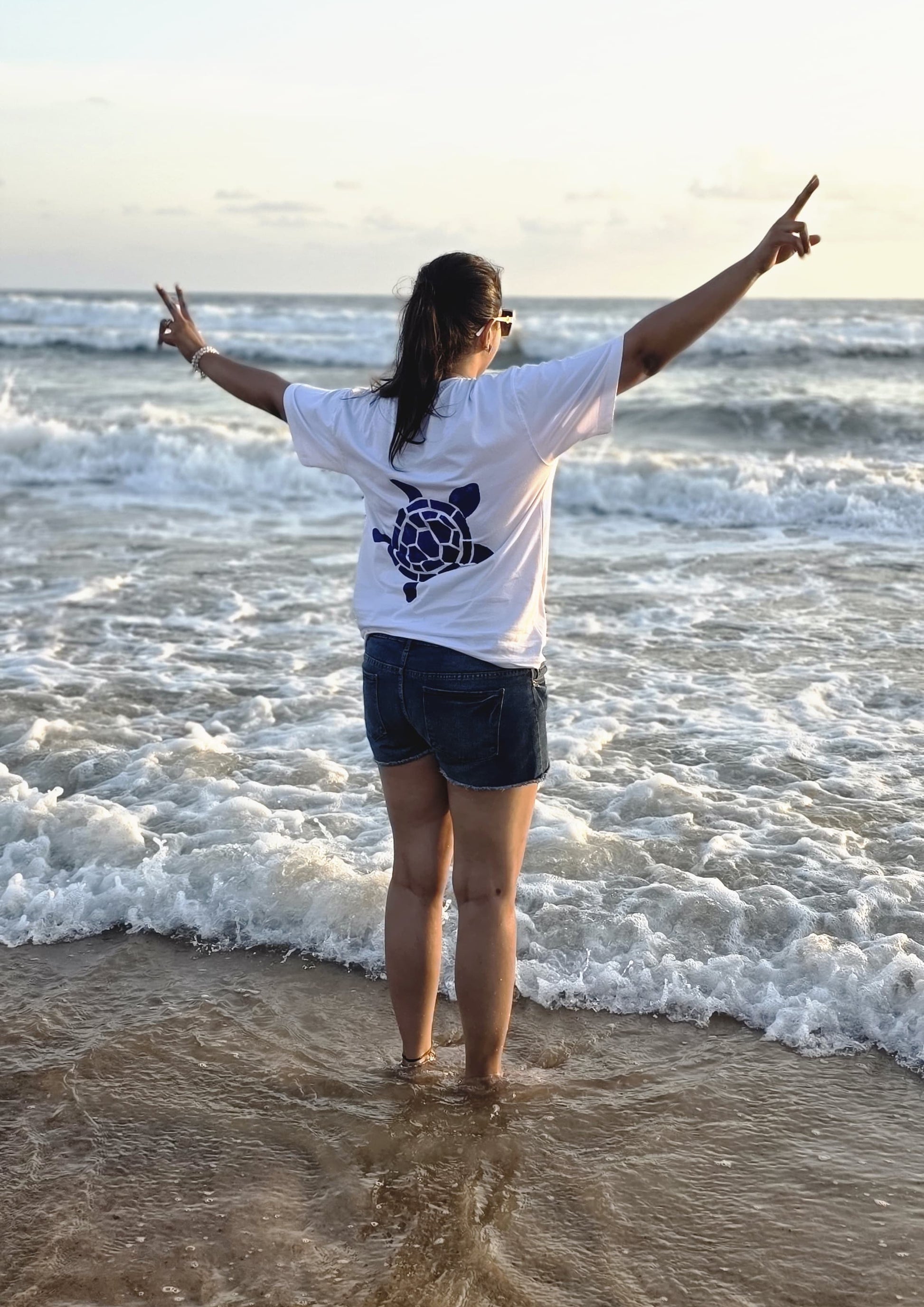 Artisan hand-painted sea turtle cotton t-shirt with unique front and back turtle artwork for everyday wear.