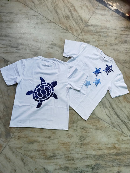 Artisan hand-painted sea turtle cotton t-shirt with unique front and back turtle artwork for everyday wear.