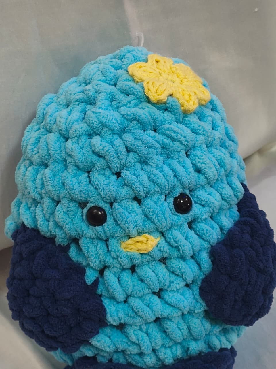 Cute handmade crochet duck plush crafted from soft blanket yarn for nursery décor and baby gifts.