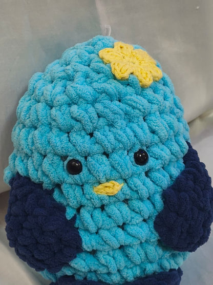 Cute handmade crochet duck plush crafted from soft blanket yarn for nursery décor and baby gifts.