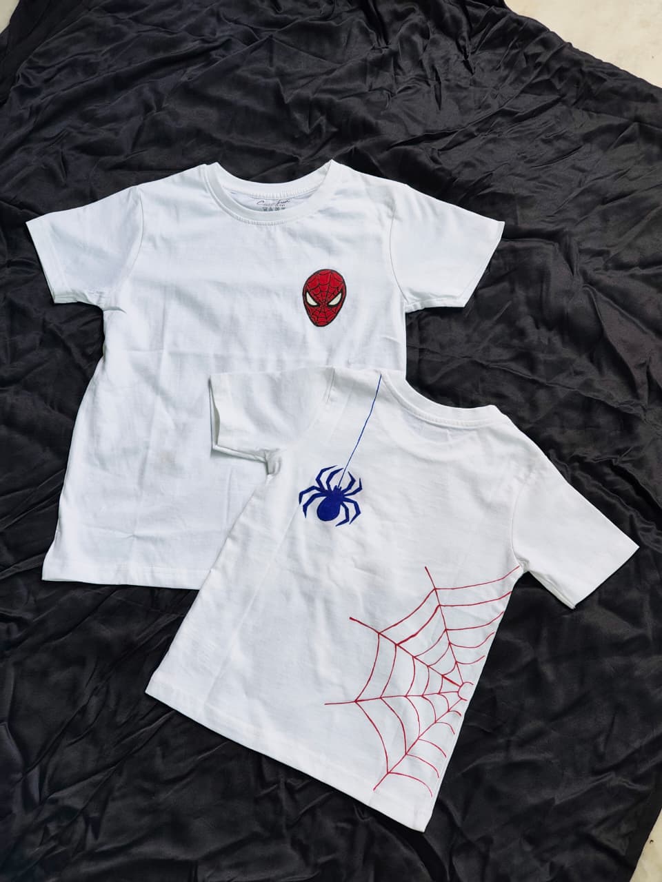 hand-painted Spider-Man kids T-shirt featuring a Spider-Man mask on the front and a spider web design on the back, handmade cotton superhero apparel.