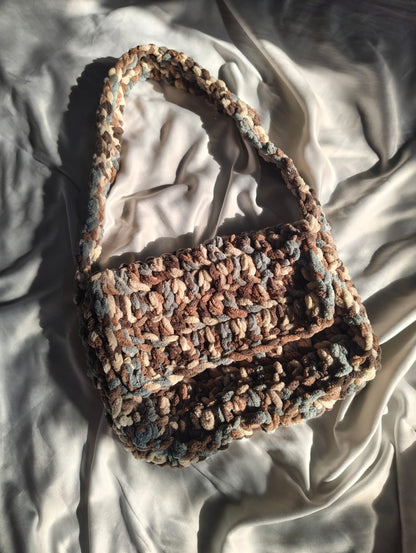 Handmade crochet shoulder bag in neutral tones
