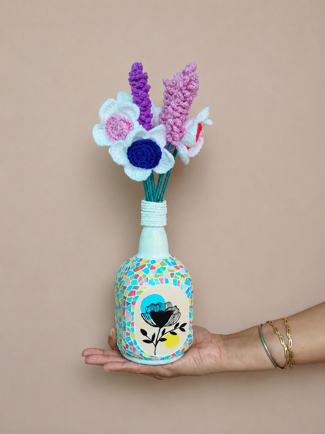 Hand-painted mosaic decorative bottle for home decor with colorful handmade artwork.