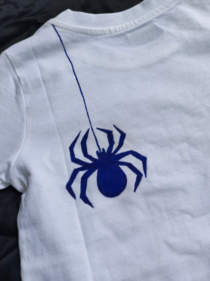 and-painted Spider-Man kids T-shirt with a blue spider and red spider web artwork, custom handmade Marvel-inspired apparel.
